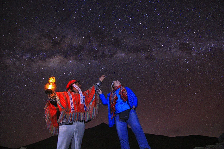 ravelers enjoying astrotourism in Cusco and Puno, Peru, under clear Andean skies while learning about Indigenous astronomy and stargazing traditions.