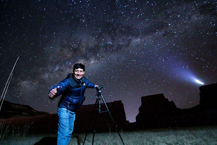 Night sky over Lake Titicaca in Puno, Peru, featuring the Milky Way reflected on the water and showcasing one of the best stargazing experiences in the Andes.