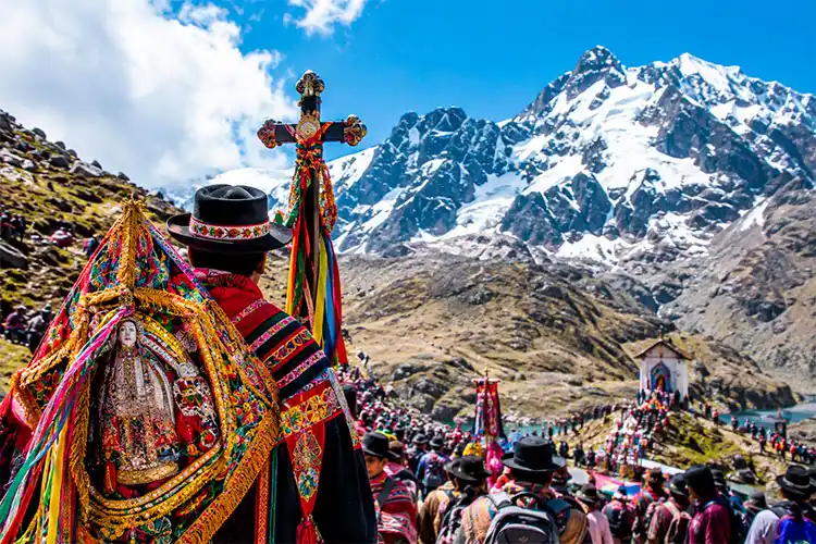 Arriving at the Qoyllur Rit'i Festival Peru with pilgrims traveling through the high Andes near Cusco.